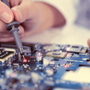 Hardware Tech Soldering a Circuit Board