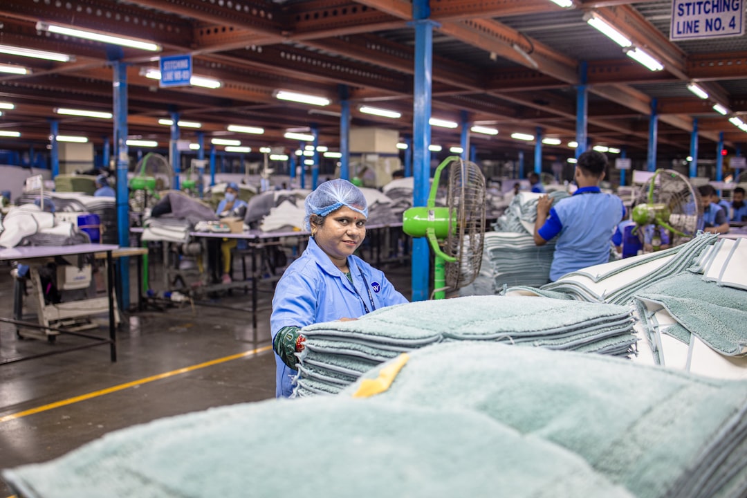 Textile workers produce towels in a factory.