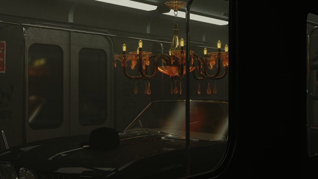 a train car with a chandelier hanging from the ceiling